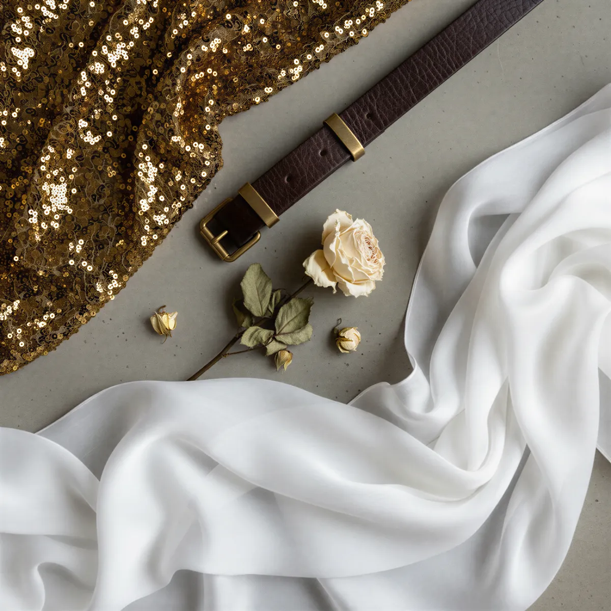 Collage of textures and colors representing diverse boudoir aesthetics: glamour, strength, resilience, and freedom.